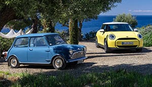 The family resemblance is striking between the original Mini (left) and the latest MINI Cooper E.